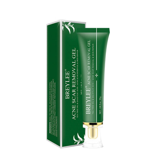 A green tube of BREYLEE Herbal Skin Refining Gel with Tea Tree & Botanical Extracts stands upright next to its matching green box, both featuring white text and decorative leaves. The tube has a gold base and a clear cap.